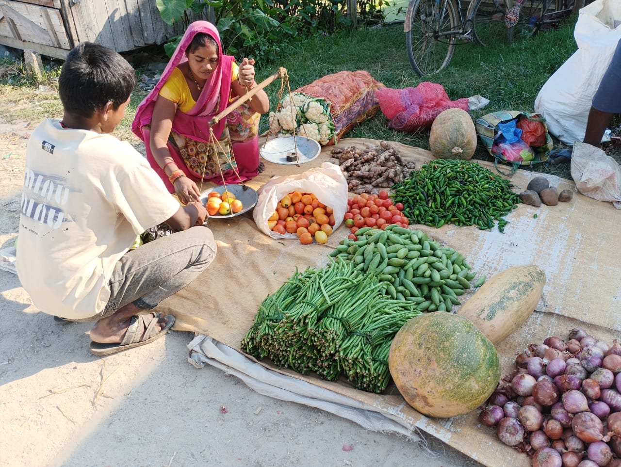 Ram Kumari sales vegetable in the local weekly market