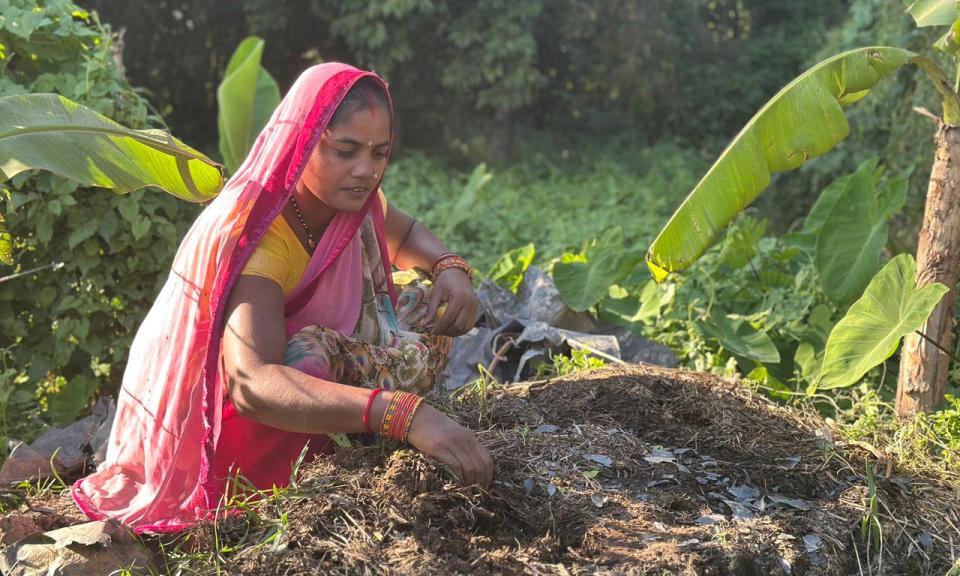 Ram Kumari preparing compost using cow dung and dry matter 