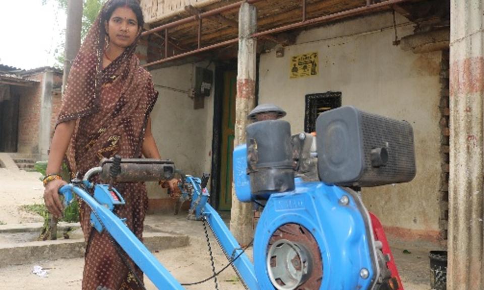 Sarita with an agricultural machine 